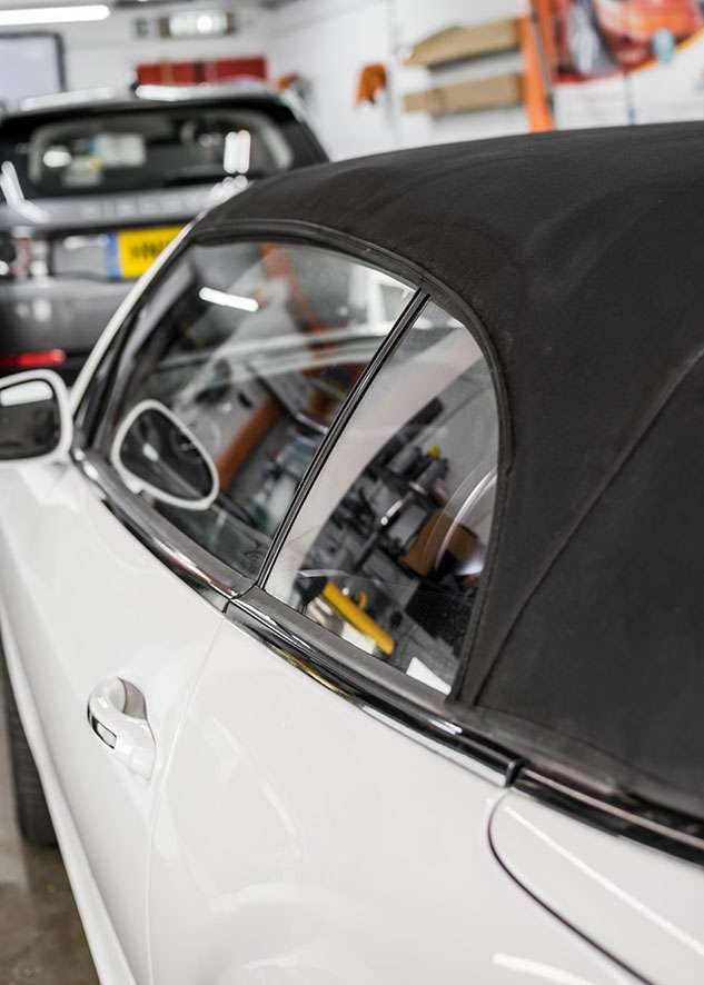 Close shot of Bentley Continental GT car with untinted windows from side