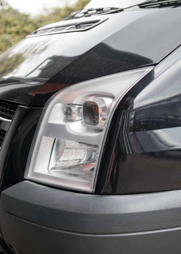 Close up shot of left side Ford Transit cloudy/foggy headlight before headlight restoration