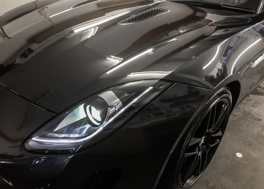 Maserati GranTurismo car being vinyl wrapped in khaki green