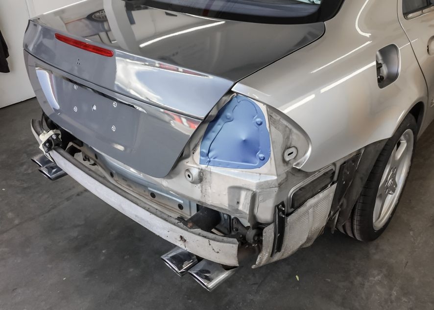 Mercedes E55 AMG being vinyl wrapped in nardo grey