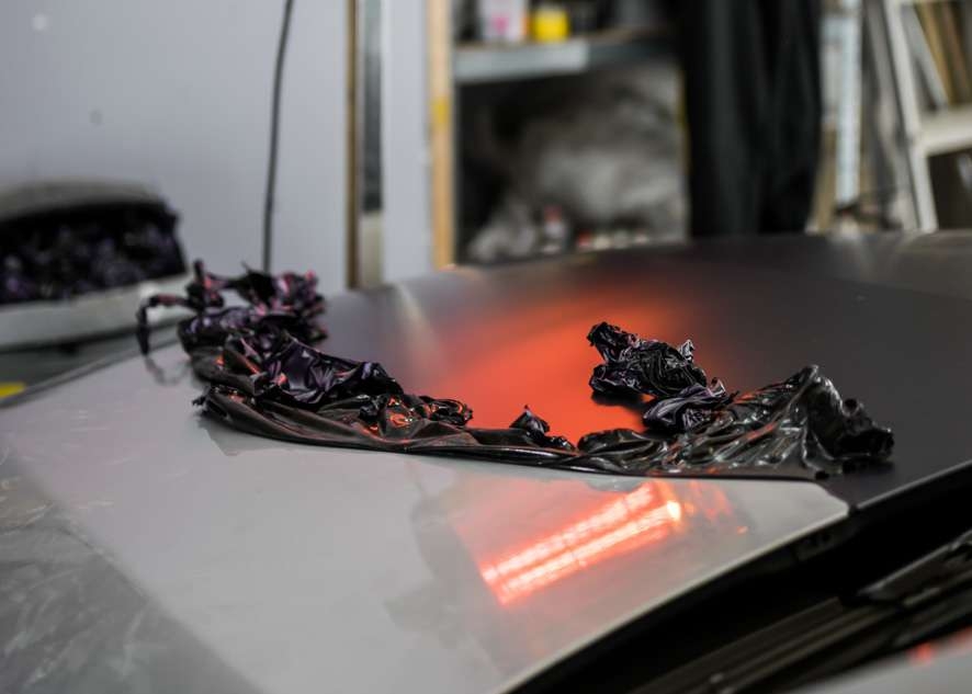 Removal of purple vinyl wrap from car grey Mercedes C Class