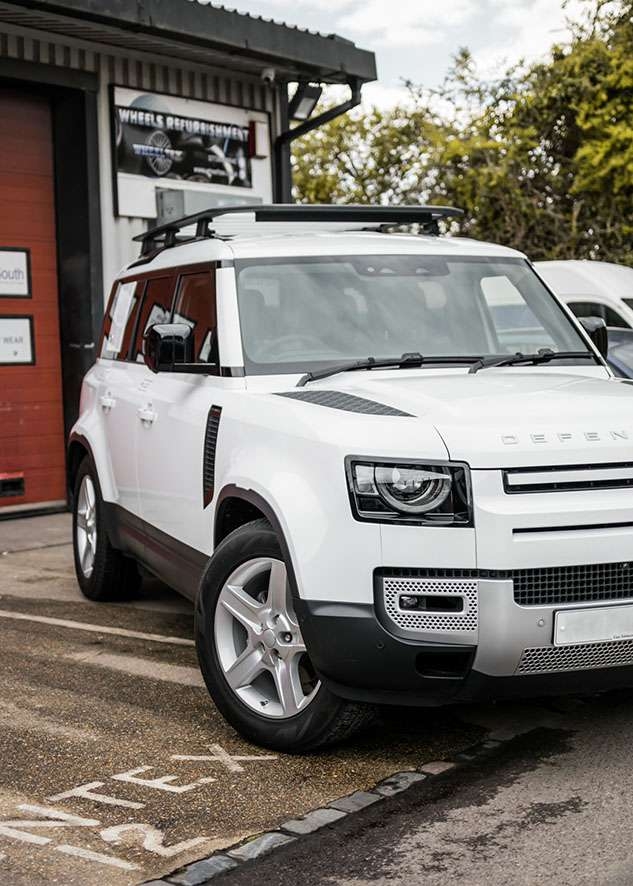 White Land Rover Defender with tinted windows after window tinting