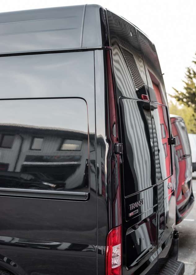 Close up shot of shiny paintwork on Ford Transit van with no scratches