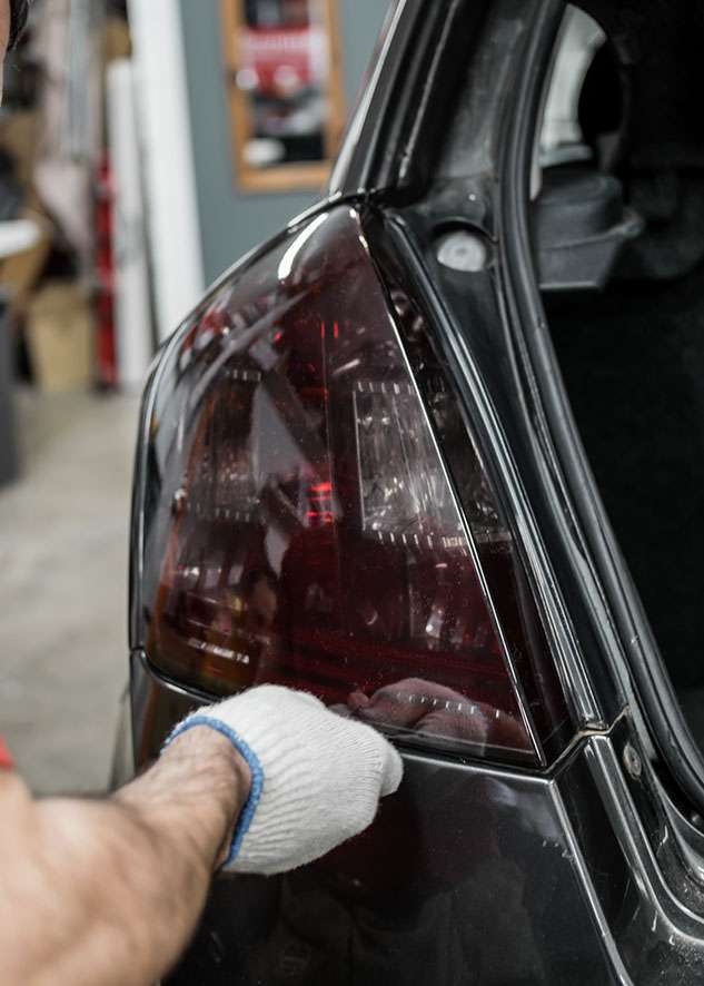 Fiat Stilo car left side rear light being tinted using LUXE Light film