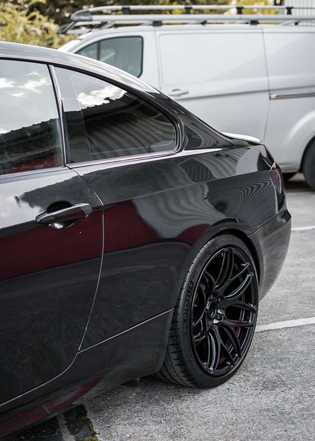 Rear of shiny BMW 335i car after polishing, paintwork correction and lights tinting