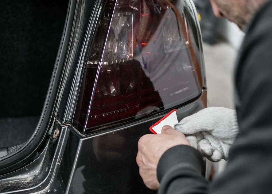Fiat Stilo car right side rear light being tinted using LUXE Light film