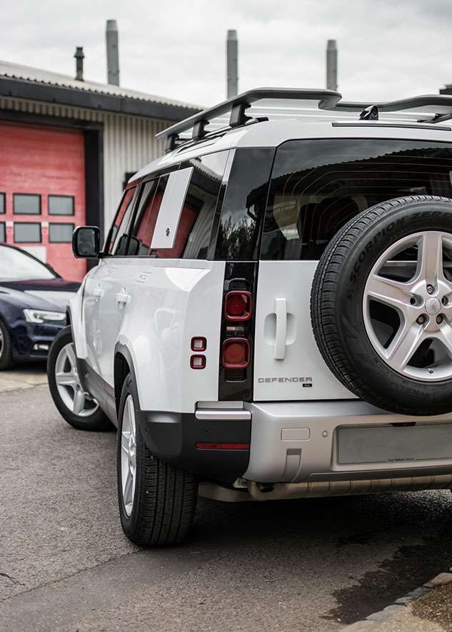 White Land Rover Defender with tinted windows after window tinting