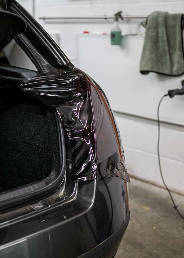 Fiat Stilo car right side rear light being tinted using LUXE Light film