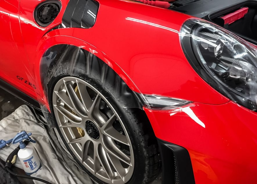 Paint protection film application on Porsche 911 GT2RS red car