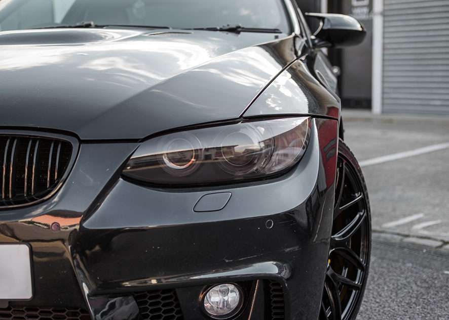 Close up shot of BMW 335i tinted headlight