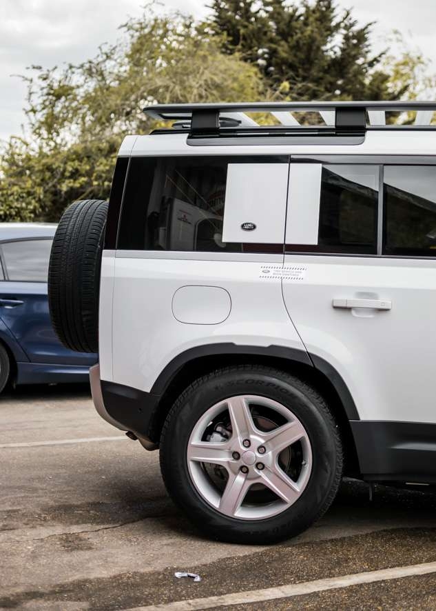 White Land Rover Defender rear and side tinted windows after window tinting