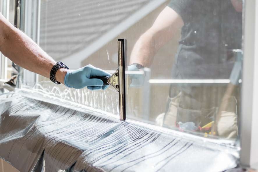 Window being tinted using dark UV protection film