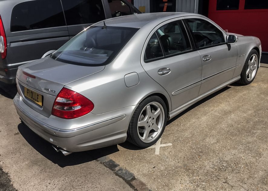 Mercedes E55 AMG being vinyl wrapped in nardo grey