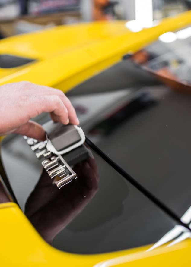 Close up shot of Kubebond ceramic coating being applied onto car yellow Ferrari 488 Pista