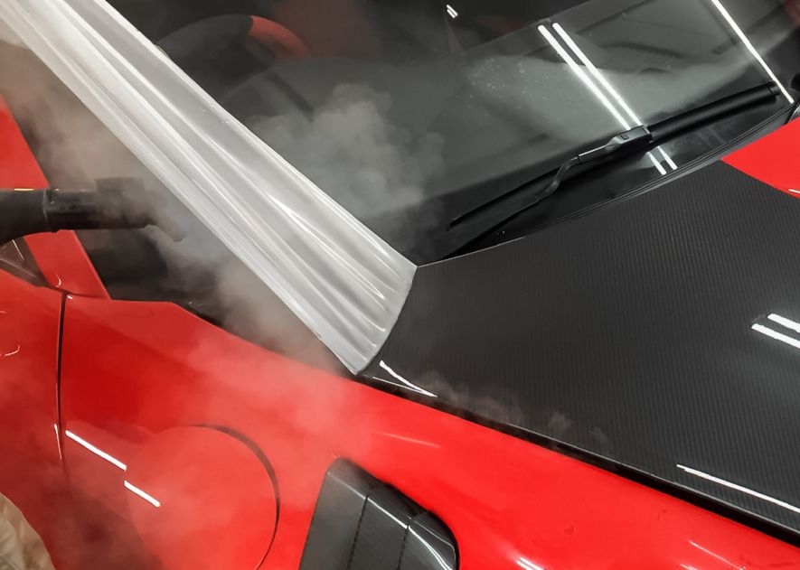 Paint protection film application on Porsche 911 GT2RS red car