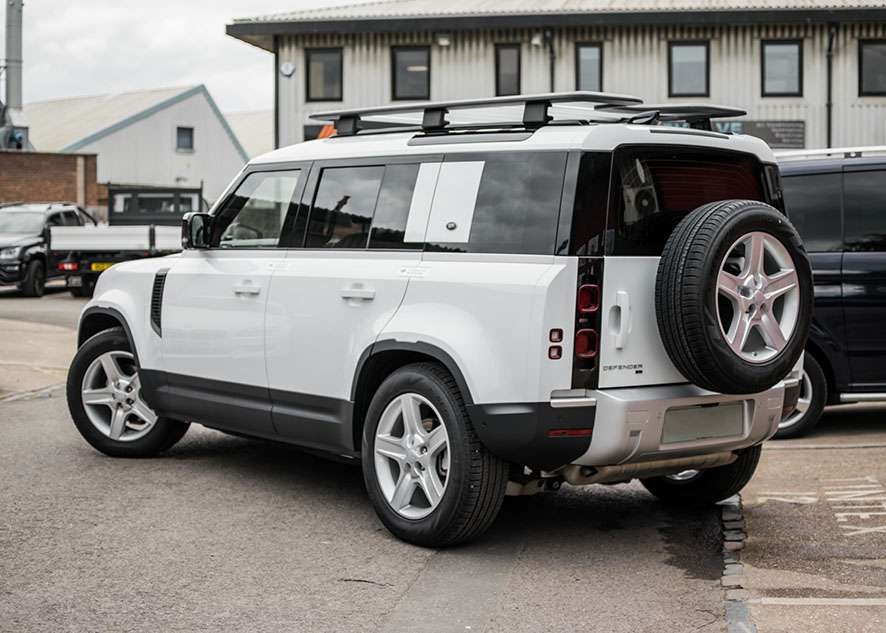 White Land Rover Defender rear and side windows tinted after window tinting