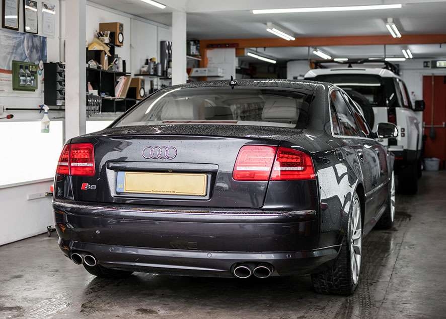 Audi s8 car inside garage/studio with untinted windows from back