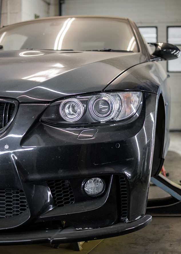 Front side shot of BMW 3 series car with poor/bad/dull paint job before paint correction