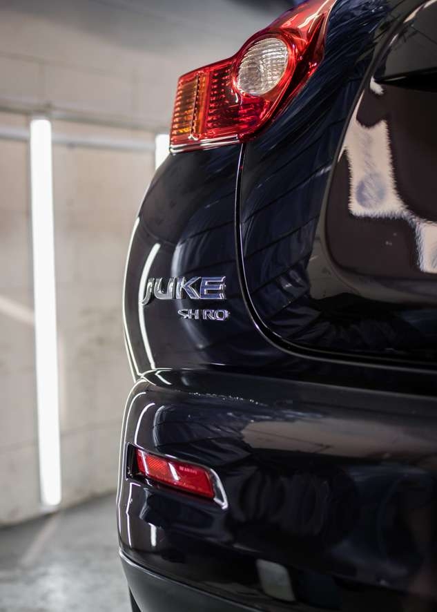 Close up shot of shiny paintwork of black Nissan Juke car after paint correction, paint correction, Paintwork Enhancement and ceramic coating