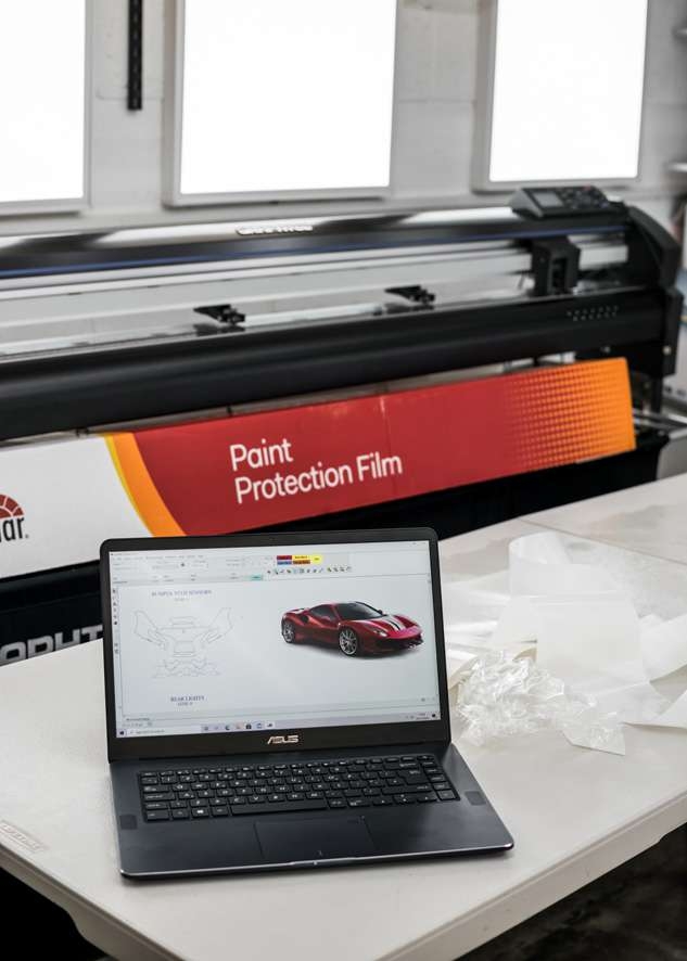 Yellow Ferrari 488 Pista car paint protection film (PPF) cutout on computer