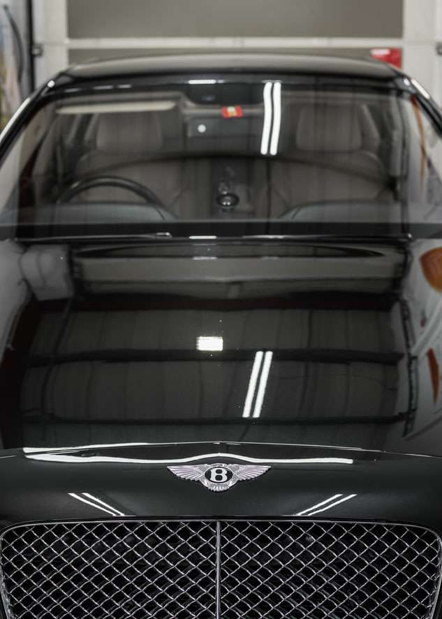 Bentley Flying Spur car bonnet after polishing, paint correction and Paintwork Enhancement with no scratches