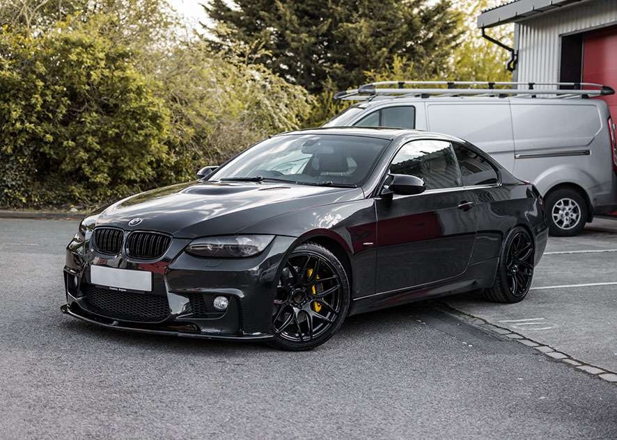 Shiny BMW 335i car after polishing, paintwork correction and lights tinting