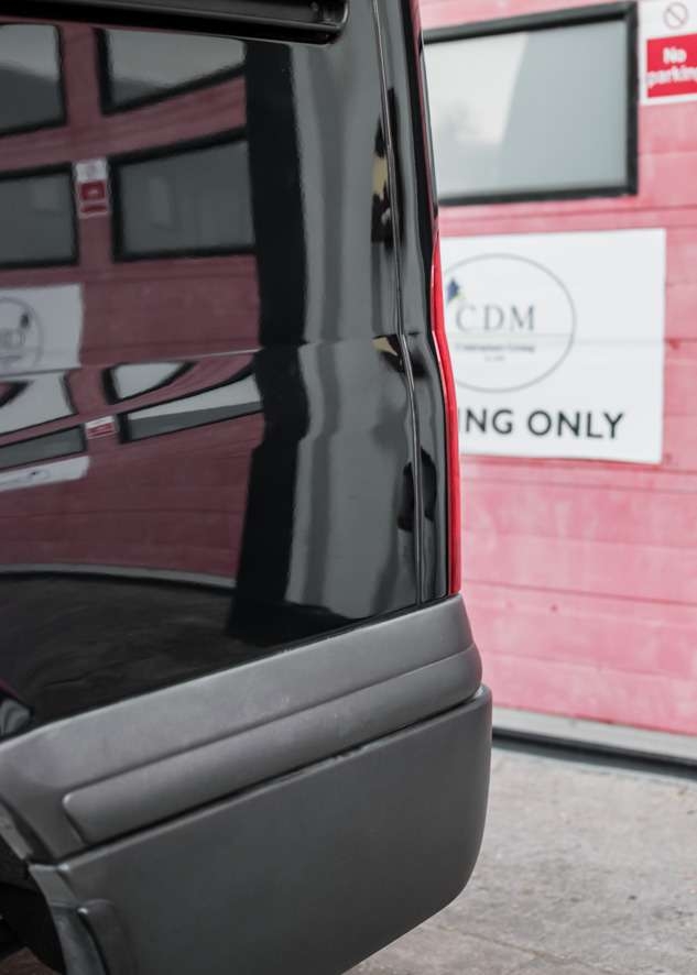Close up shot of shiny paintwork on Ford Transit van with no scratches