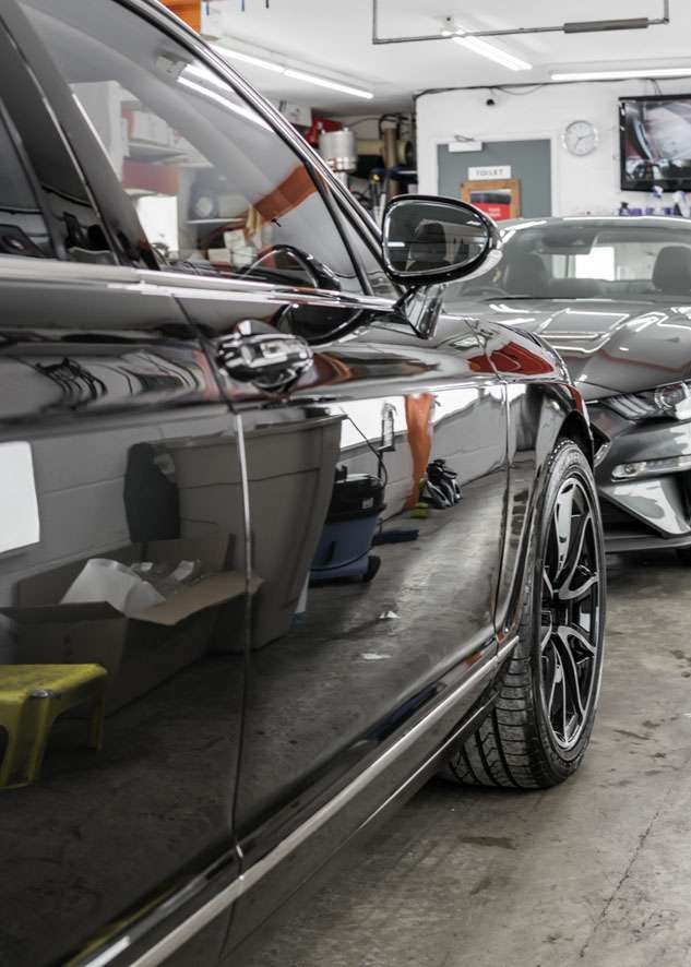 Shiny of Bentley Flying Spur after car paintwork and gloss was rejuvenated/restored by polishing, paint correction and Paintwork Enhancement