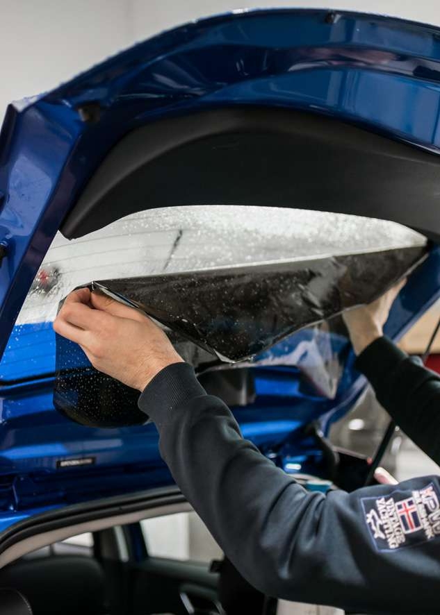 LLumar window tinting film beign applied to rear window of car Blue MG3