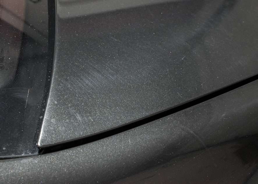 Close up shot of Bentley Flying Spur car with bad swirl marks on bonnet