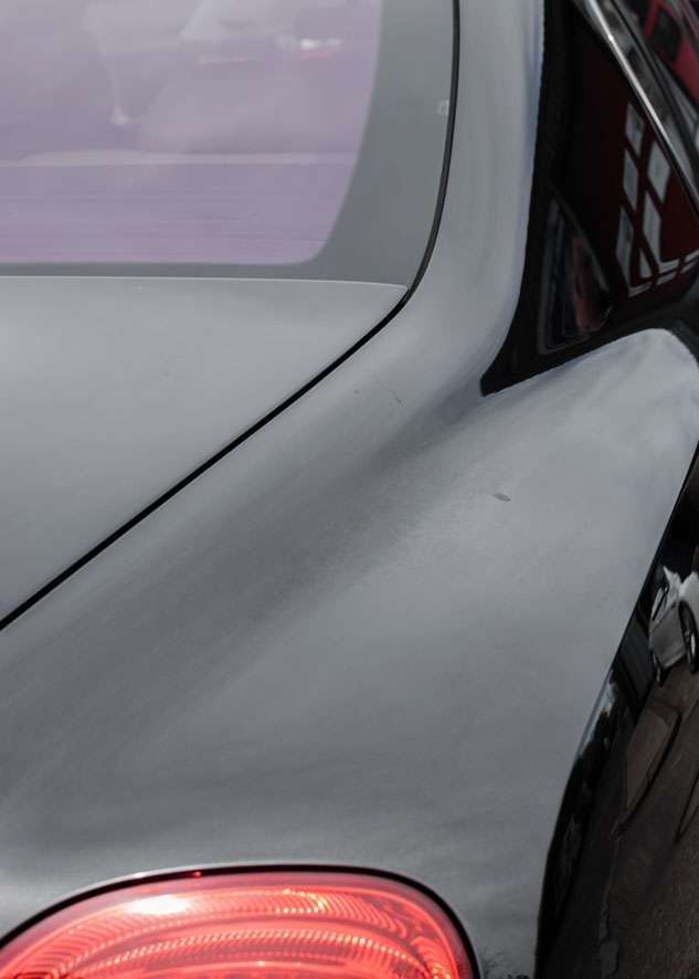 Close up shot of Bentley Flying Spur car with oxidised paint