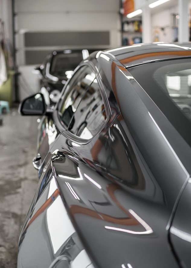 Grey Mustant GT car with shiny paintwork after polishing