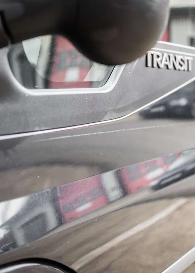 Close up shot of big scratch on paintwork on Ford Transit van 