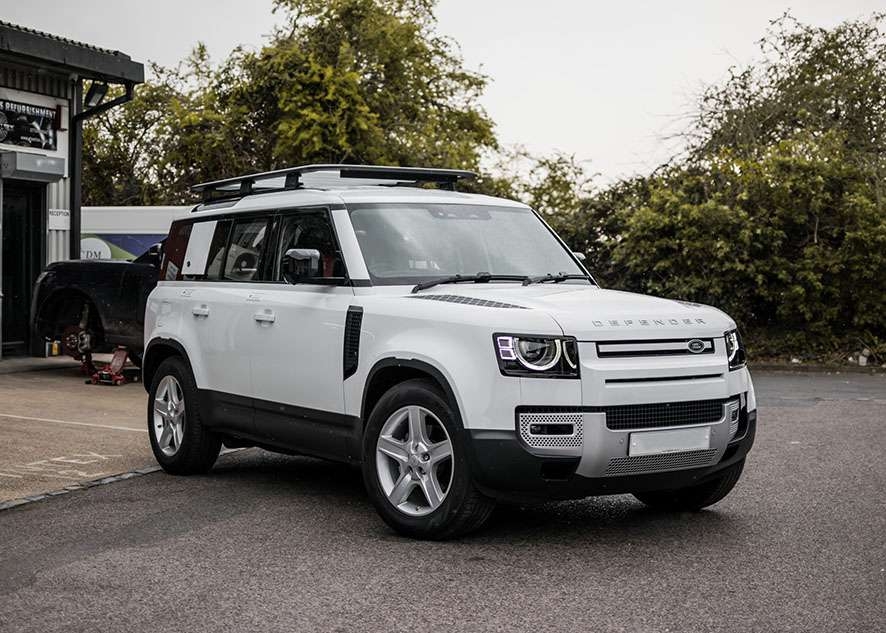 White Land Rover Defender with untinted windows before window tinting